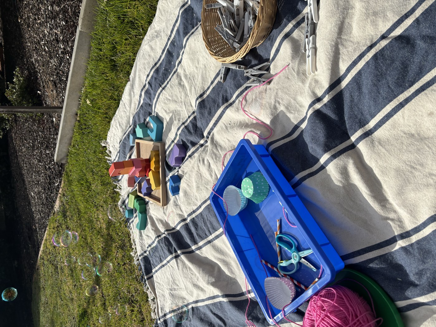 Bubbles drifting over a backyard play morning